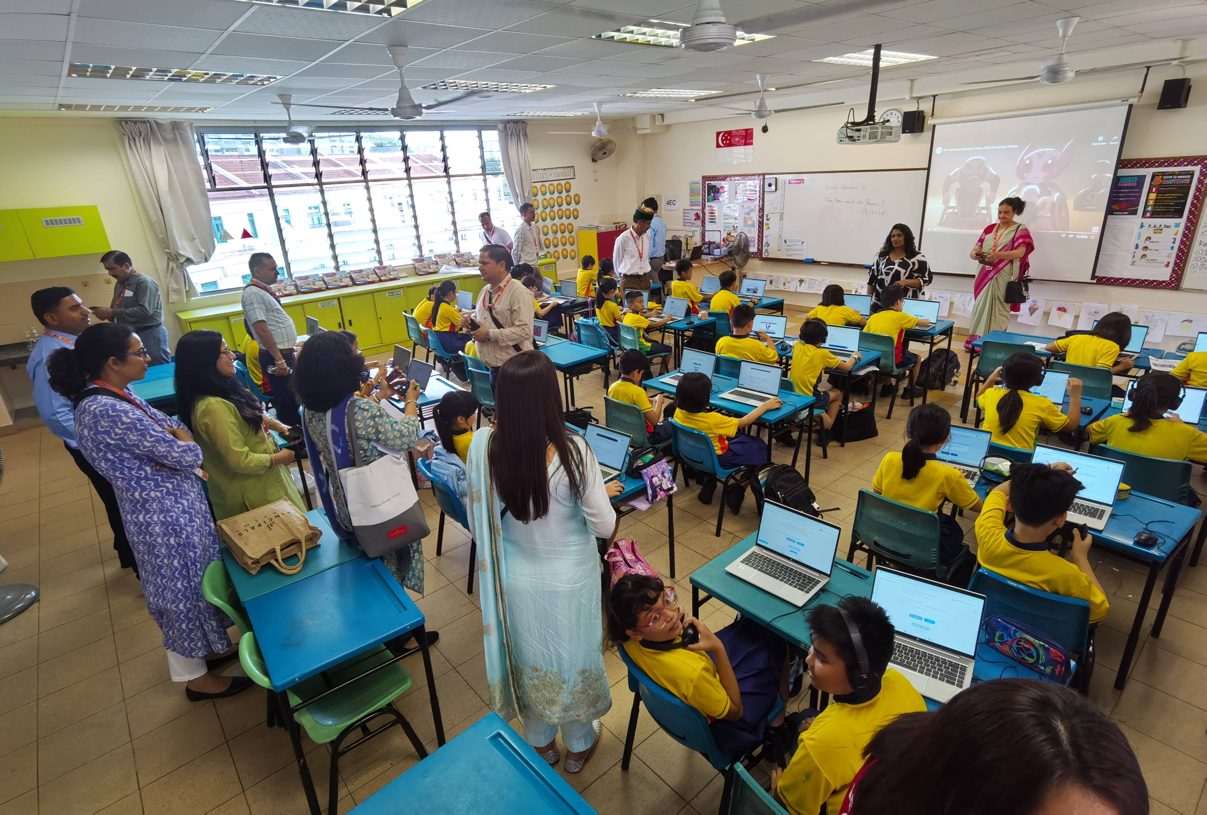 Our guests having a lesson observation in class where the students are using laptops with their lesson